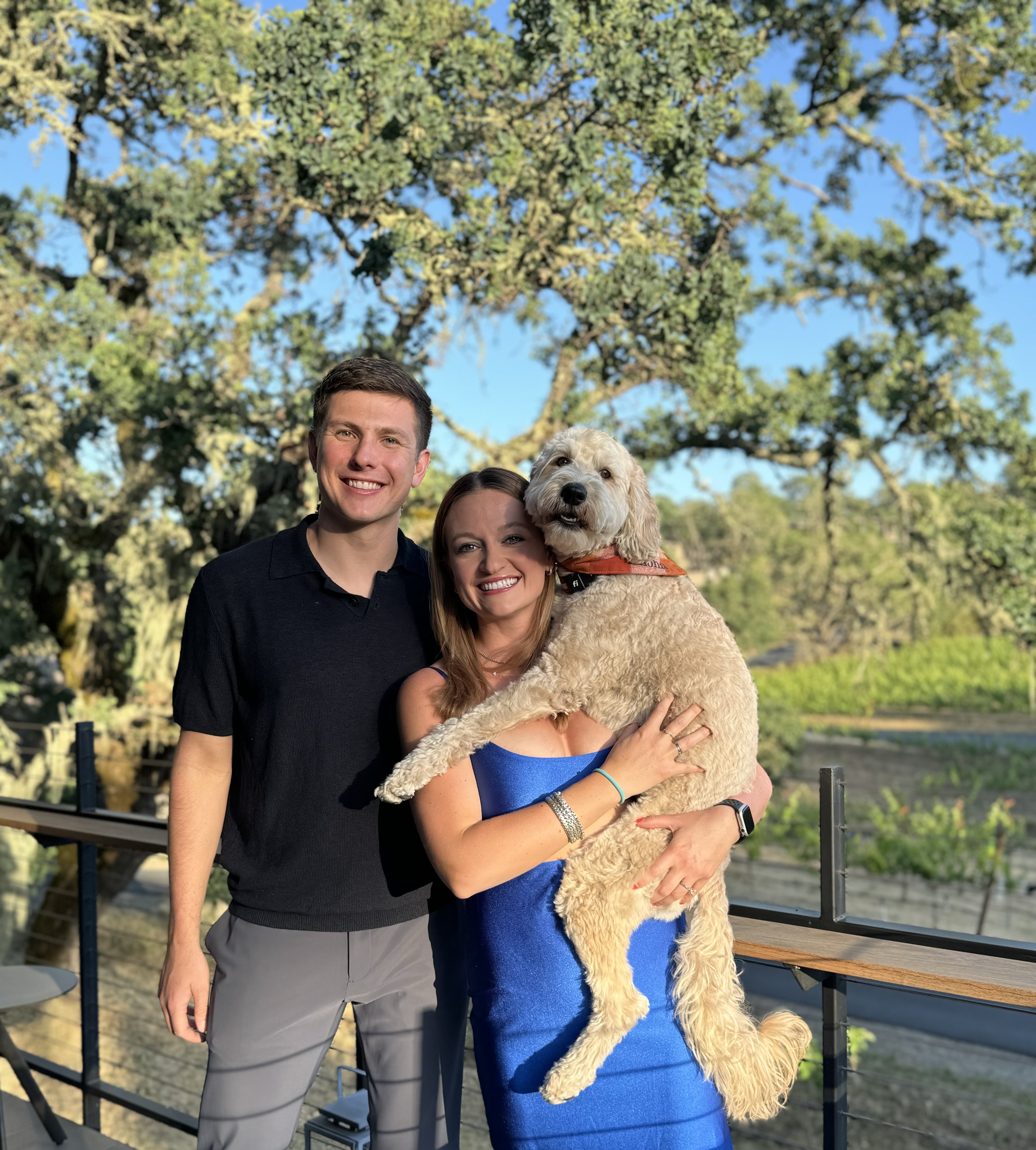 Portrait of Adam and Julianna with their dog