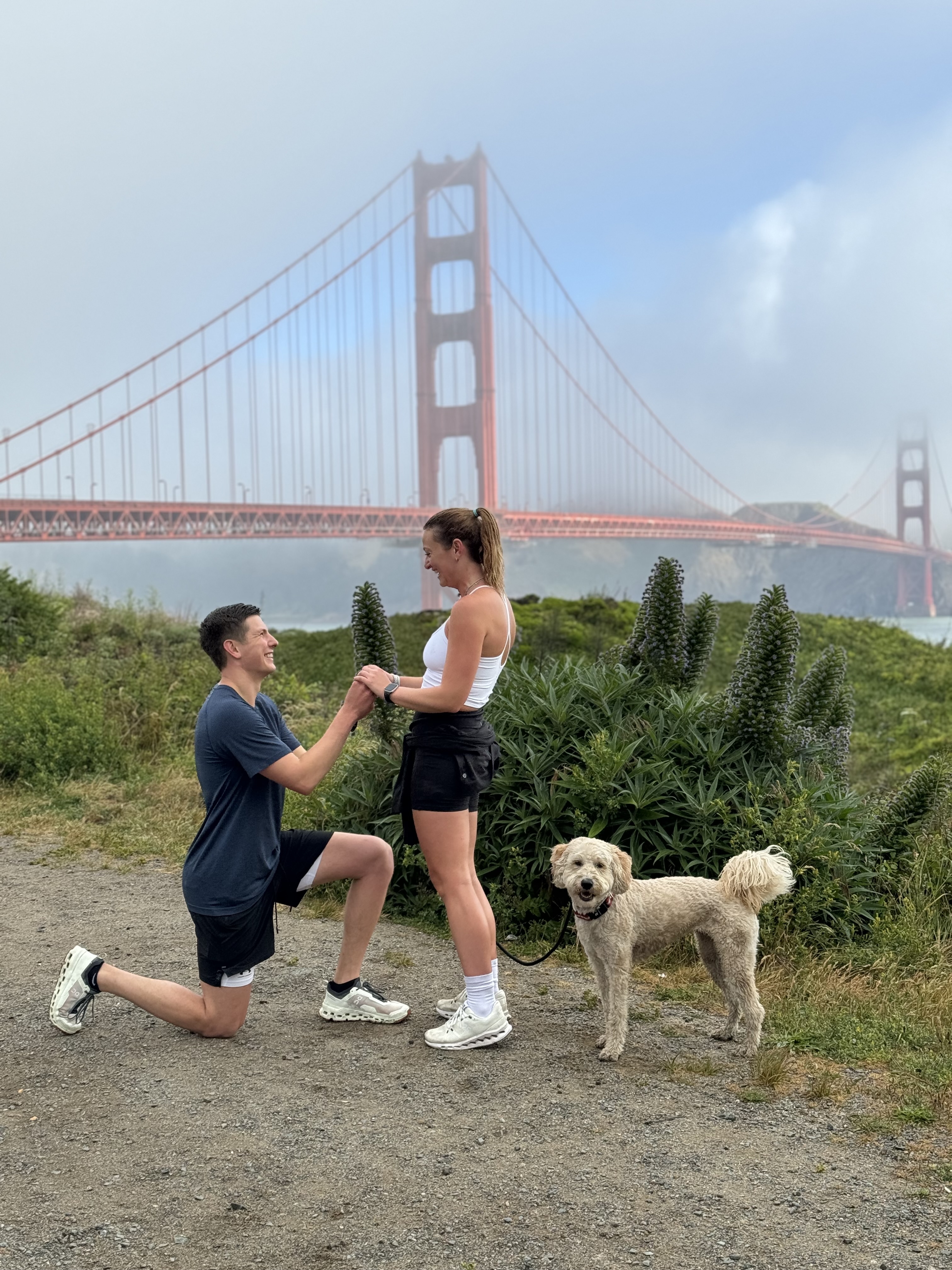 Adam proposing to Julianna with Golden Gate Bridge in background